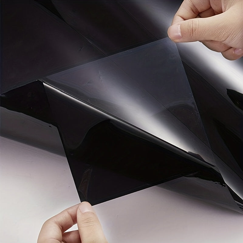 Black car window tint film roll for UV protection, measuring 300cmx50cm/118.11inx19.69in, suitable for both cars and homes.