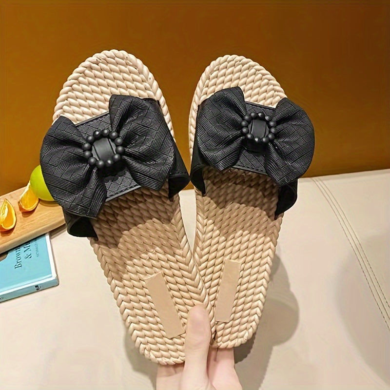 Women's PVC slip-on sandals with bow and bead accents, flat heel, open toe, ideal for beach wear.  Bow embellished, made from synthetic material.