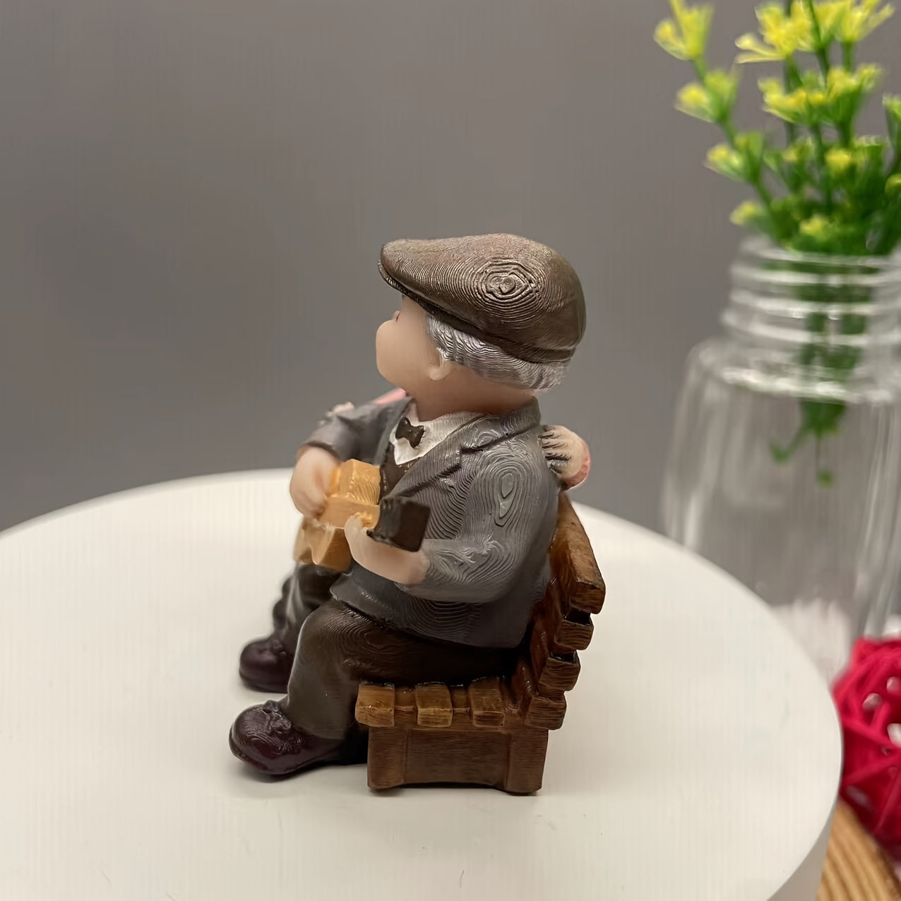 Resin figurine of charming elderly couple, ideal for home or office decor. Perfect Valentine's Day or anniversary gift.