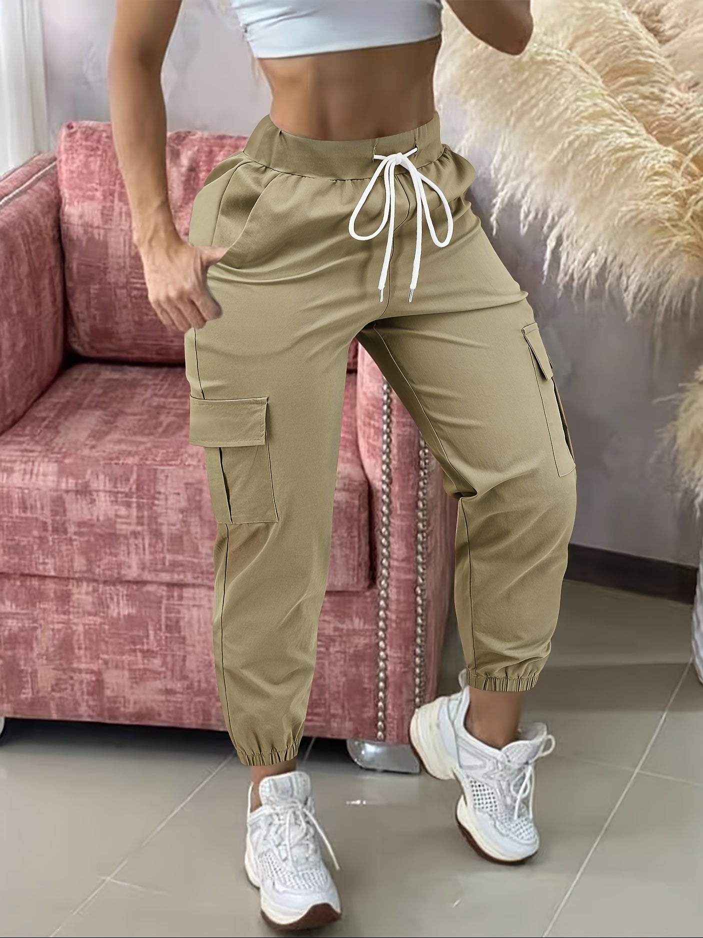 Women's casual cargo pants made of polyester with a drawstring waist.