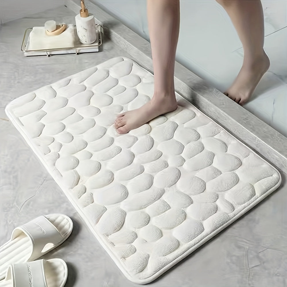 Upgrade your bathroom with the luxurious 1PC Pebble Embossed Memory Foam Bath Mat. This quick-drying carpet not only adds a touch of elegance to your living room but also provides a comfortable and washable non-slip surface for your bathroom. Elevate