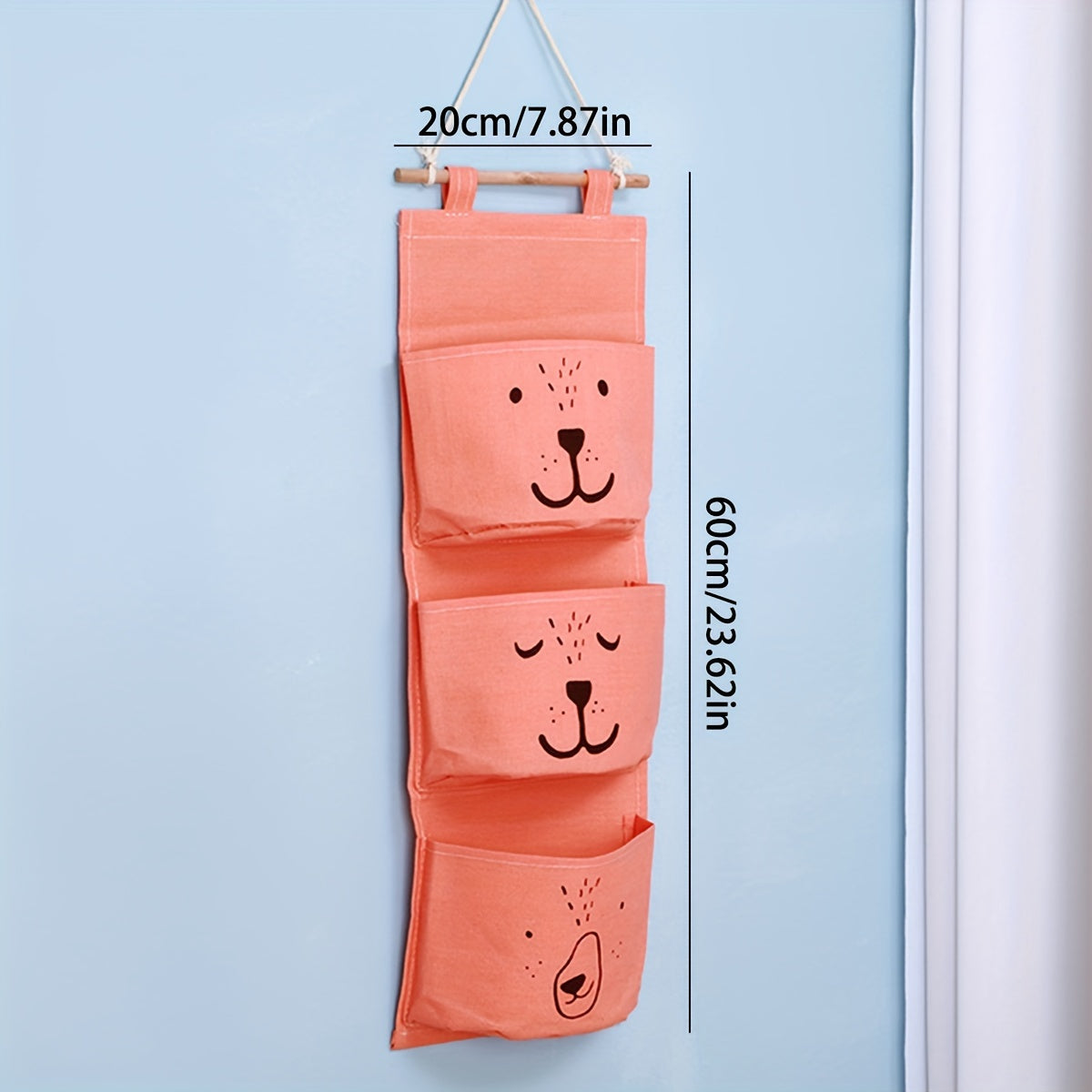 Stay organized with the adorable bear face wall hanging organizer! Made of durable polyester, this large capacity storage solution is perfect for keeping clothes and diapers neatly stowed away. Easy to assemble, the organizer measures under 68.58 cm for