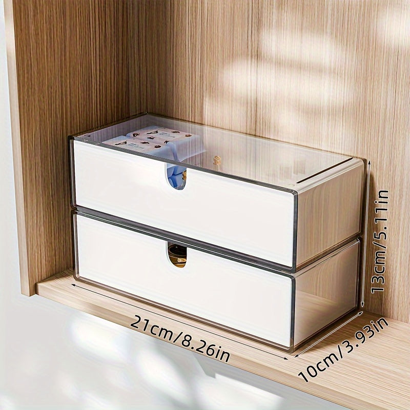 Cosmetics storage box with drawers, stackable design for bathroom and bedroom organization.