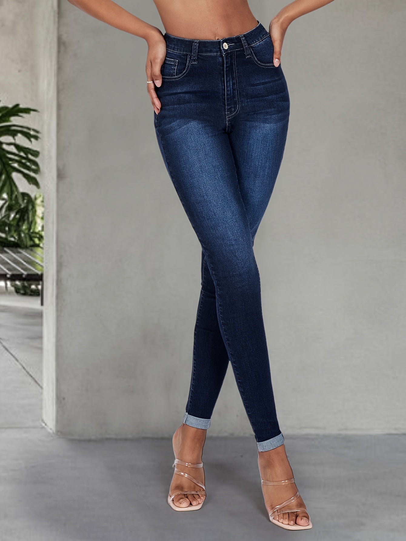 Elegant high stretch skinny jeans for women, long length with button detail, perfect for all seasons.