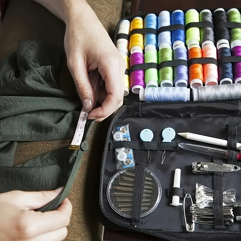 Portable travel sewing kit made of black denim material includes needles, threads, scissors, and basic sewing accessories for quick repairs.