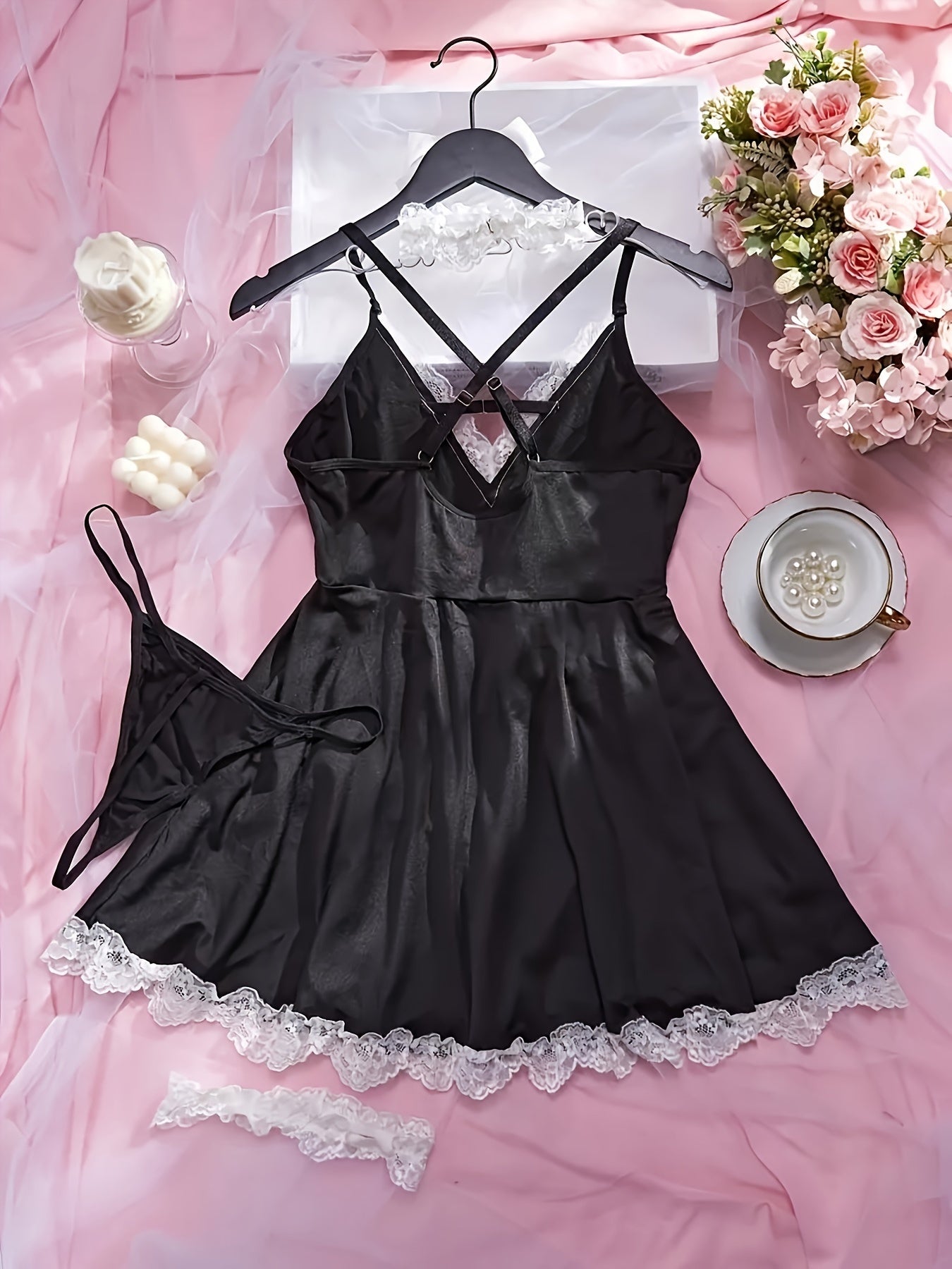 Seductive four-piece set with maid uniform, lingerie, leg rings, necklace, and underwear.