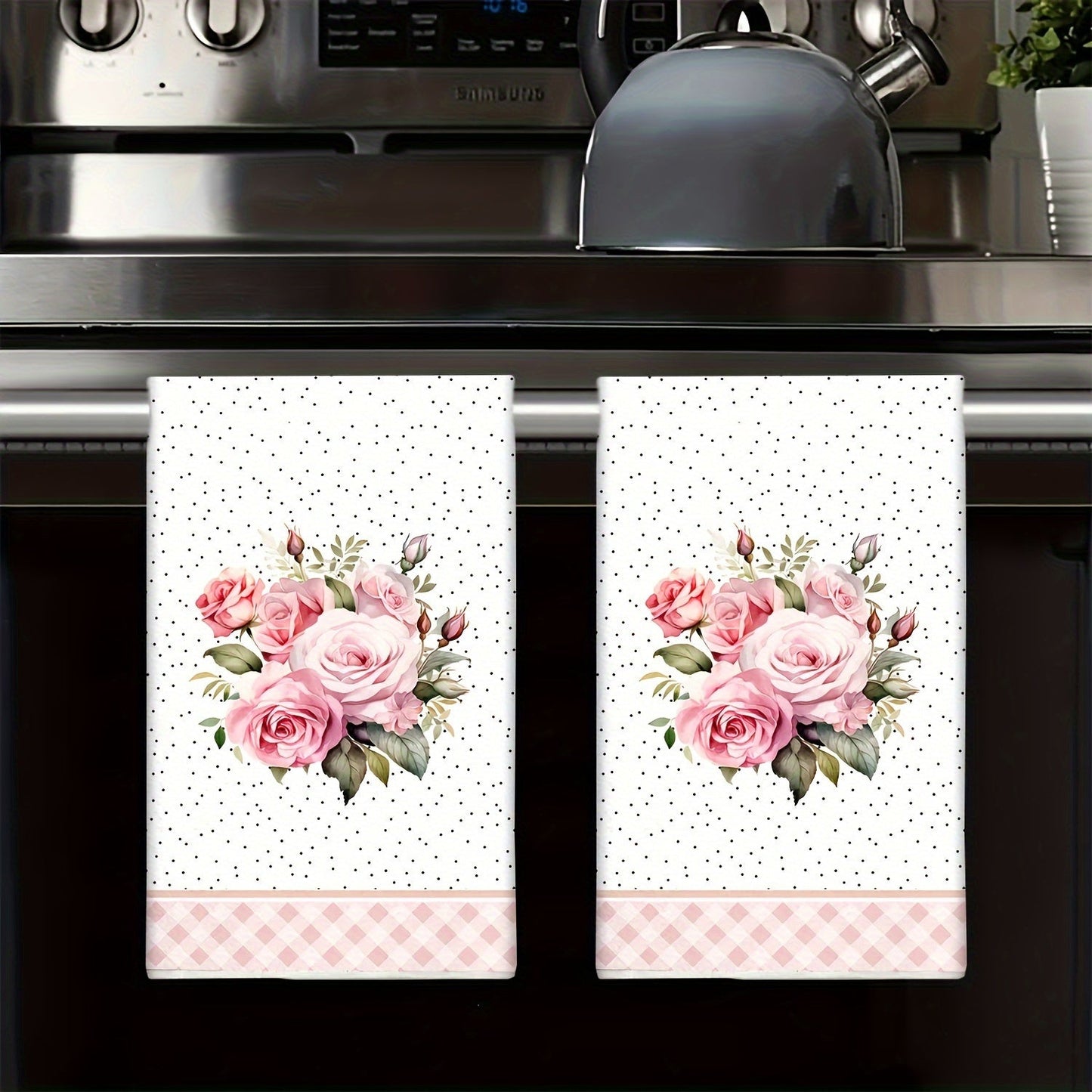 Two pieces of contemporary kitchen towels that are highly absorbent and quick-drying, ideal for use in cooking and baking. These towels make the perfect housewarming gift, featuring a decorative cartoon design. They are machine washable and made of