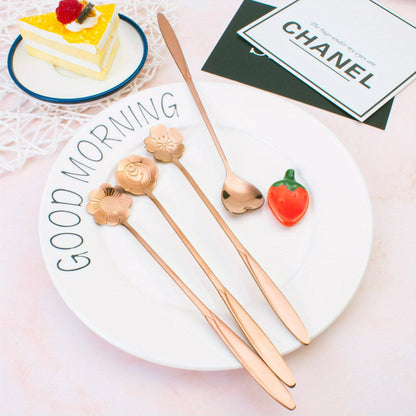 Four stainless steel cherry blossom coffee/dessert spoons.