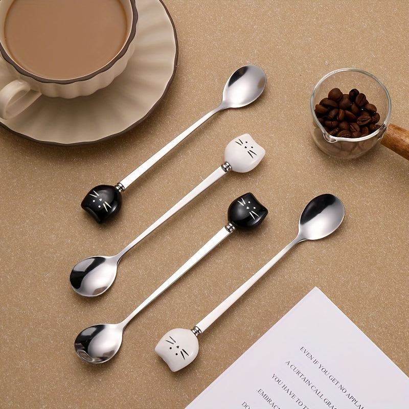 Charming stainless steel coffee stirrers with whimsical ceramic kitty spoons.