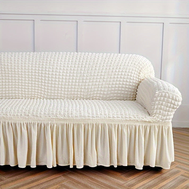 Seersucker skirt sofa cover protects couch from cat scratches in bedroom, office, or living room.