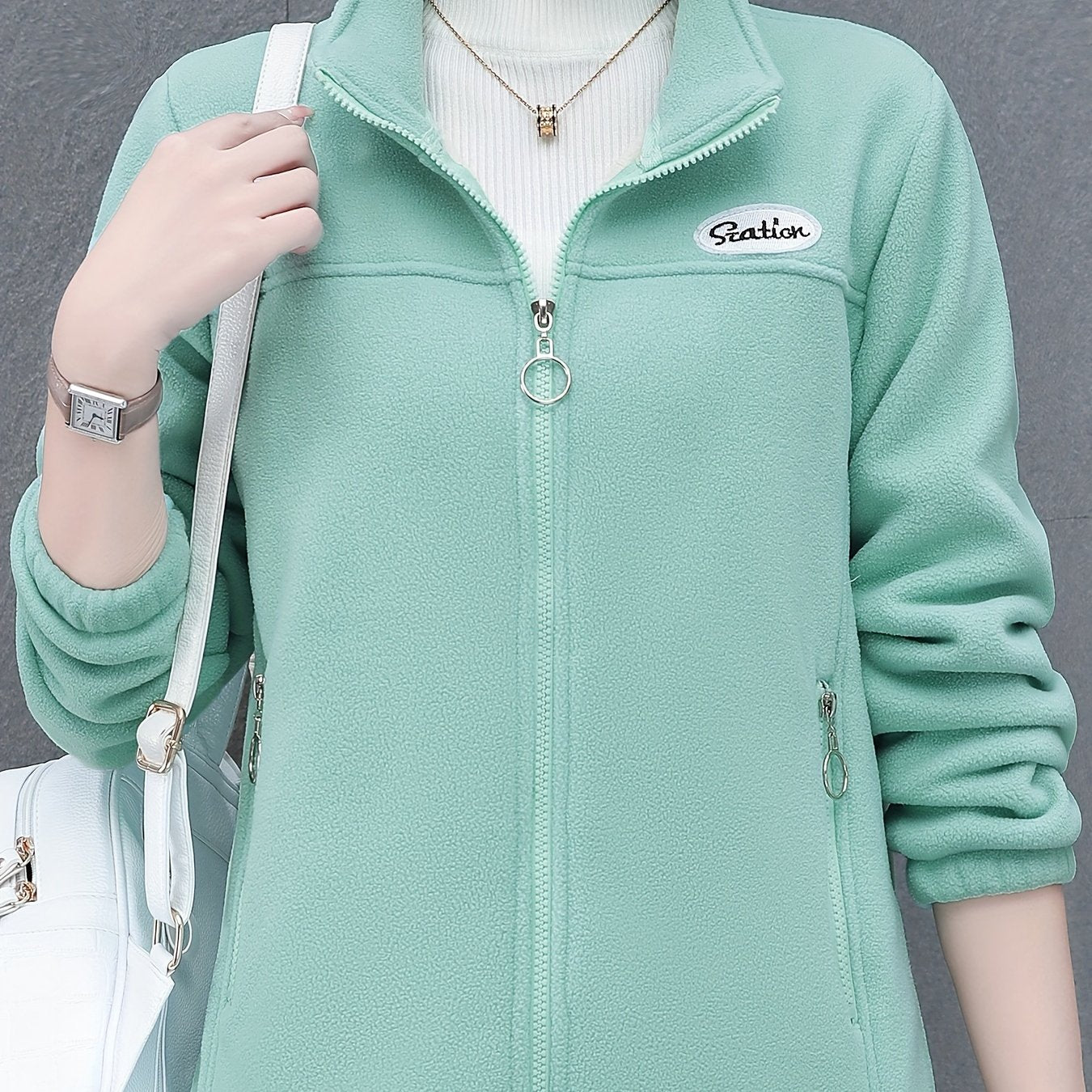 Women's casual fleece jacket with alphabet pattern, stand collar, long sleeves, regular fit, oversized, and zipper detail.