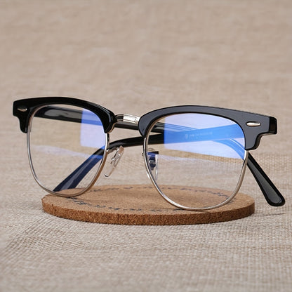 Chic black eyeglass frame for women with retro golden anti-blue light feature, clear transparent lenses, and eyebrow-shaped design, also suitable for men's computer glasses.