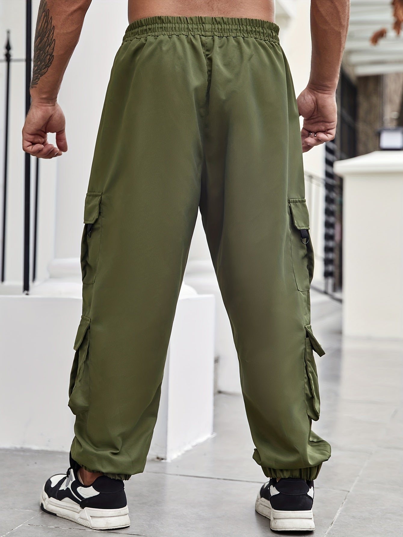 Men's plus size cargo pants with pockets for spring and fall fashion.