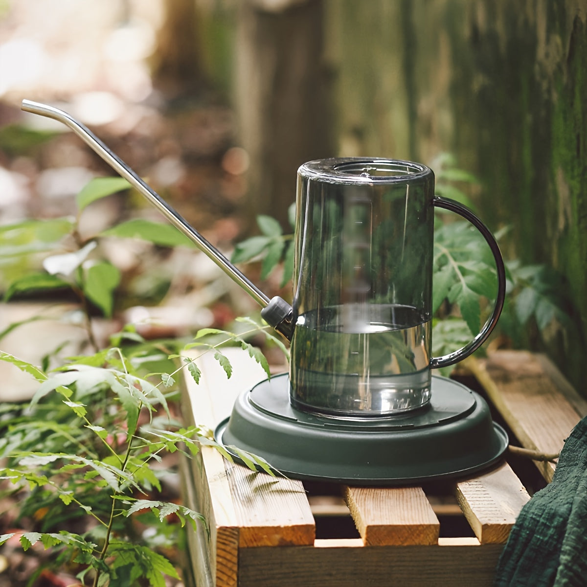 Long-spouted plastic watering can for indoor and outdoor plants.