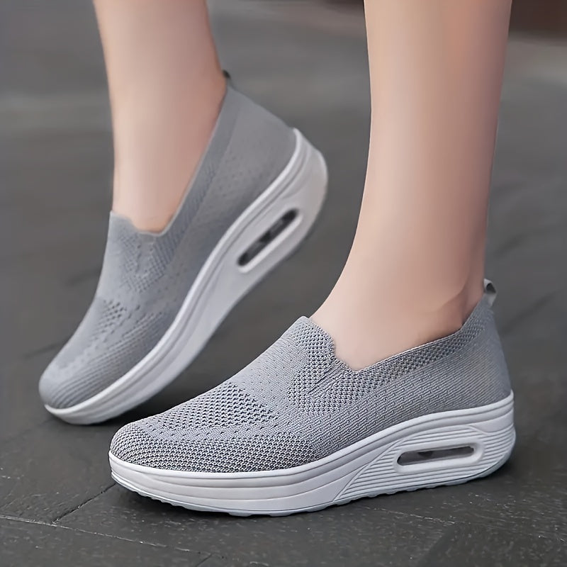 Women's slip-on sneakers from the Spring Collection in solid colors of black, light gray, pink, and dark blue. Features breathable knit fabric, air cushion sole, and low-top design for