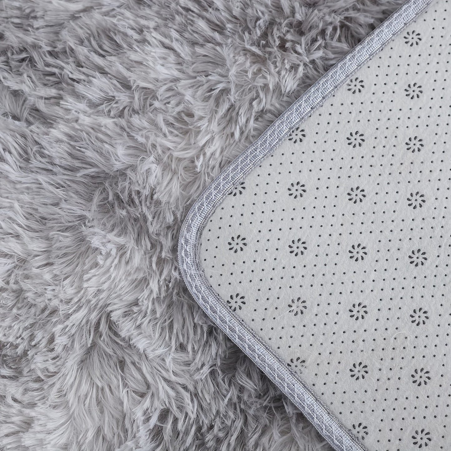 Soft and cozy shaggy area rug perfect for bedroom or living room decor. This plush light gray rug measures 160.02cm x 80.01cm and features a rectangular tie-dye design. Made of machine-washable polyester, this rug is ideal for dorm rooms and homes. Add a