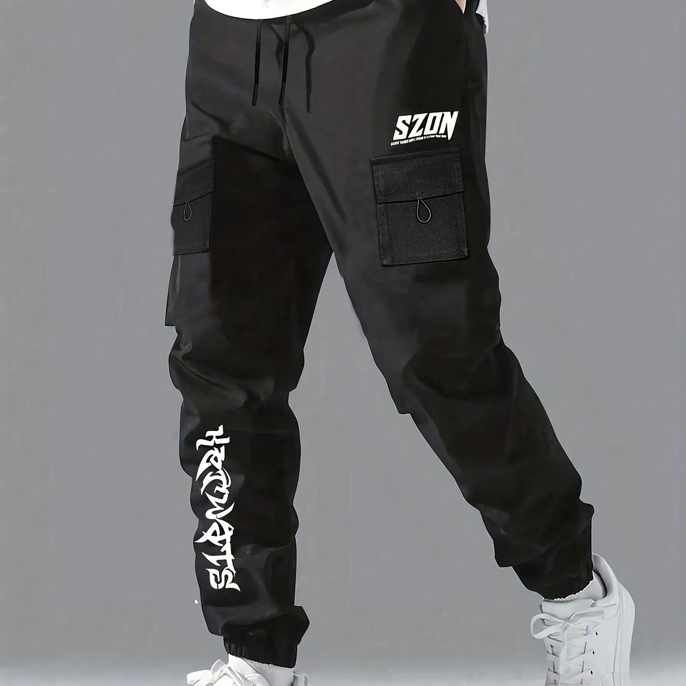 Boys casual cargo pants in solid black with elastic cuff, multi-pocket design, and comfort fit for versatile daily wear.