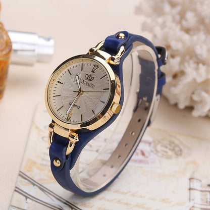 1 elegant women's quartz watch with black faux leather strap and golden-tone accents - fashionable analog display, battery operated, perfect for everyday and special occasions.