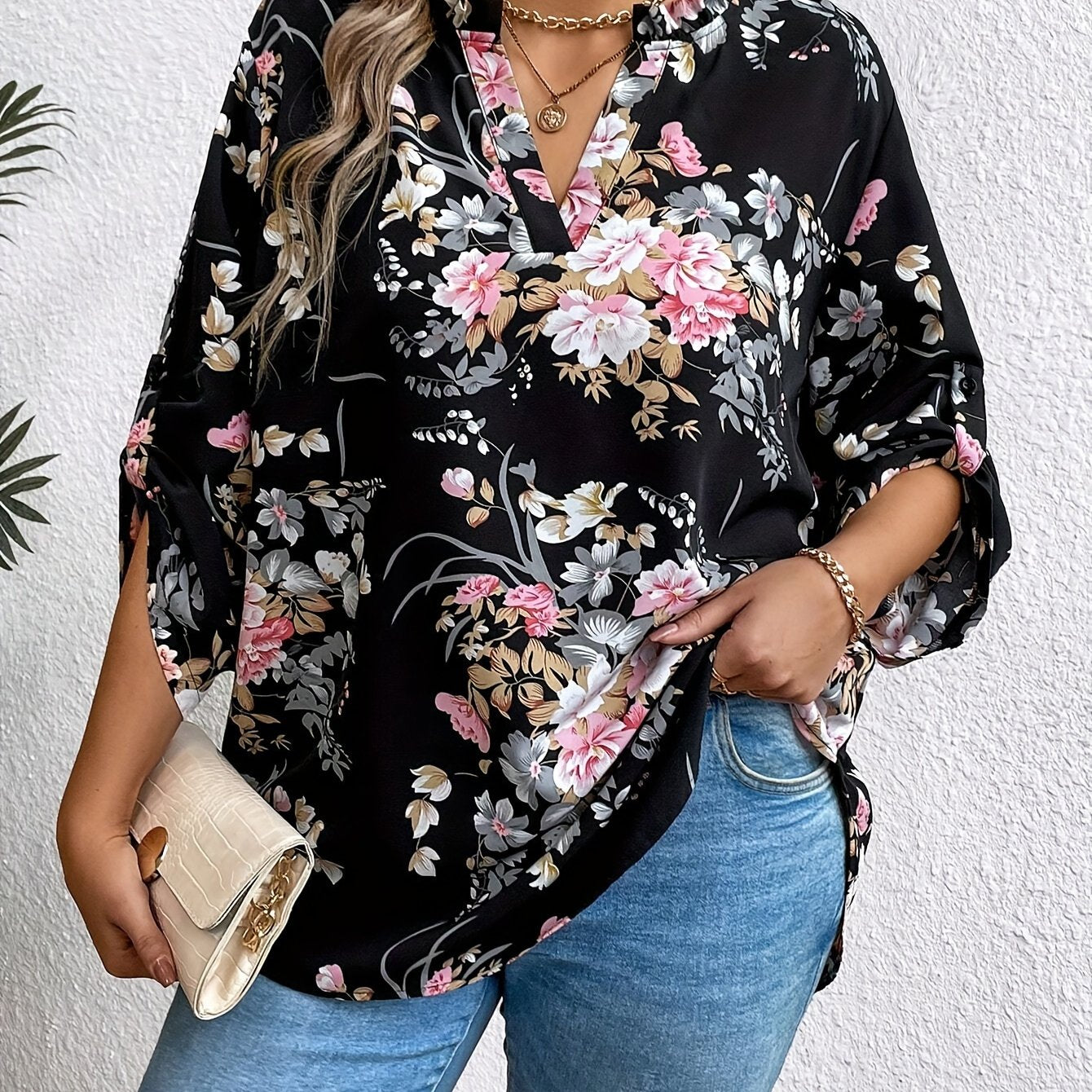 Elegant plus-size women's floral print blouse with ruffle sleeves in stylish black, perfect for casual to semi-formal occasions.