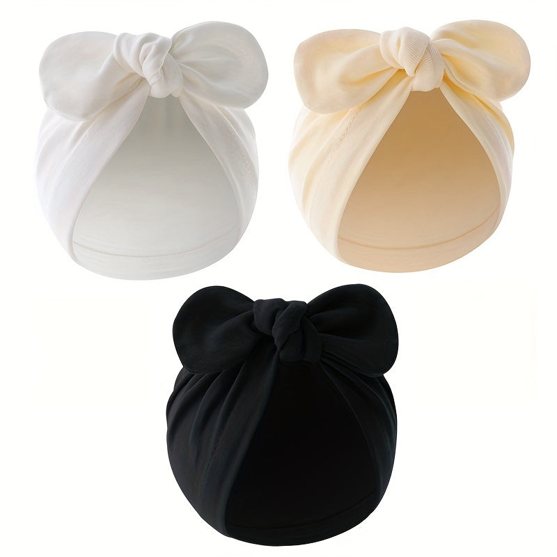 Three-pack of cotton baby turban hats with bow, suitable for newborns to 3 years old. Hand washable and lightweight, perfect for birthdays and fantasy themes.