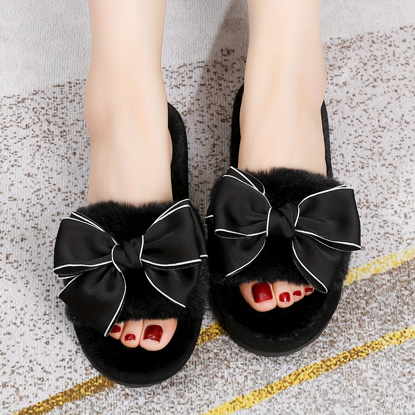 Fluffy home slippers with bowknot decoration, soft sole, non-slip, and cozy.