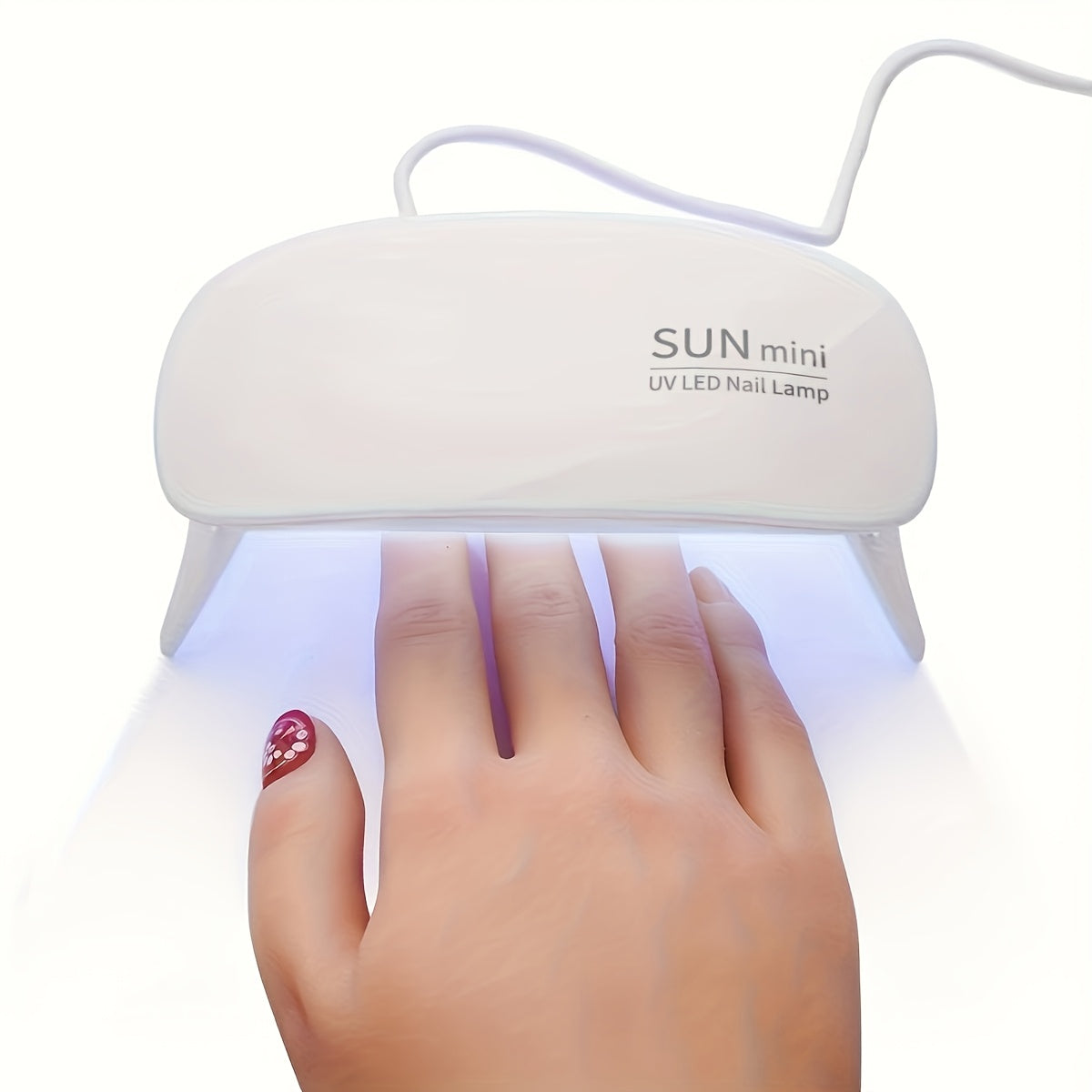 Portable mini nail lamp with 6 UV/LED light beads in pink and white. USB powered, foldable design, suitable for gel polishing and drying. Ideal for hand, foot, and nail care.