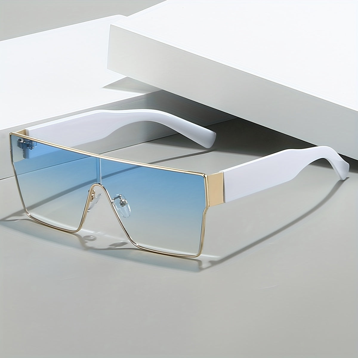 Hiking glasses with metal frame and anti-reflective lenses, featuring a trendy square design for unisex fashion.