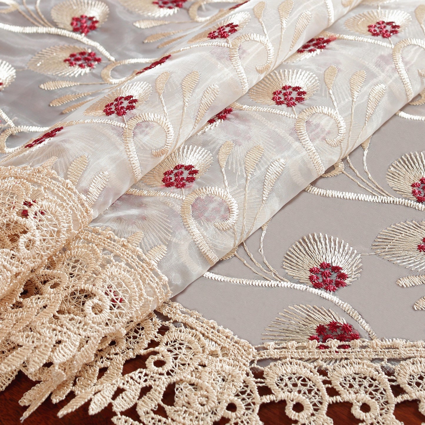 Polyester embroidered table runner for holiday and wedding decor.