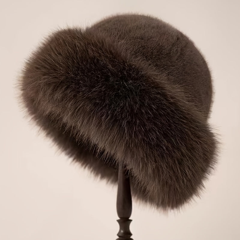 Stylish faux fur bucket hat for women with warm polyester lining.