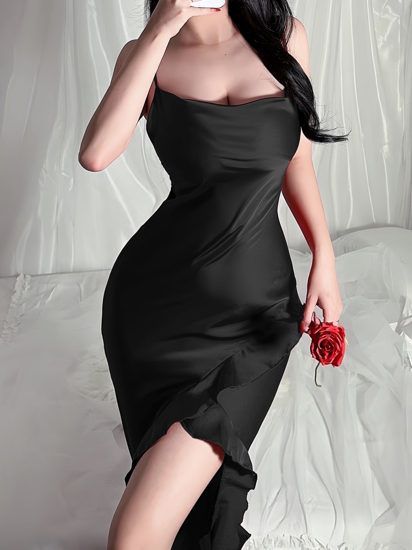 Long dress with thin suspenders and open back, featuring irregular ruffled slit design.