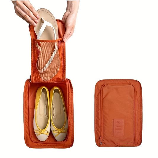 Orange shoe storage bag with mesh front pocket, zippered closure, lightweight material for neat shoe organization.