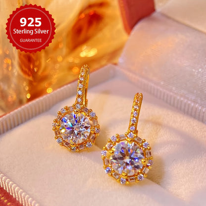 These elegant earrings feature two dazzling 1CT Moissanite round stones set in 925 sterling silver, with a total weight of approximately 2.91 grams. Perfect for weddings or as a luxurious Valentine's Day gift for your beloved.