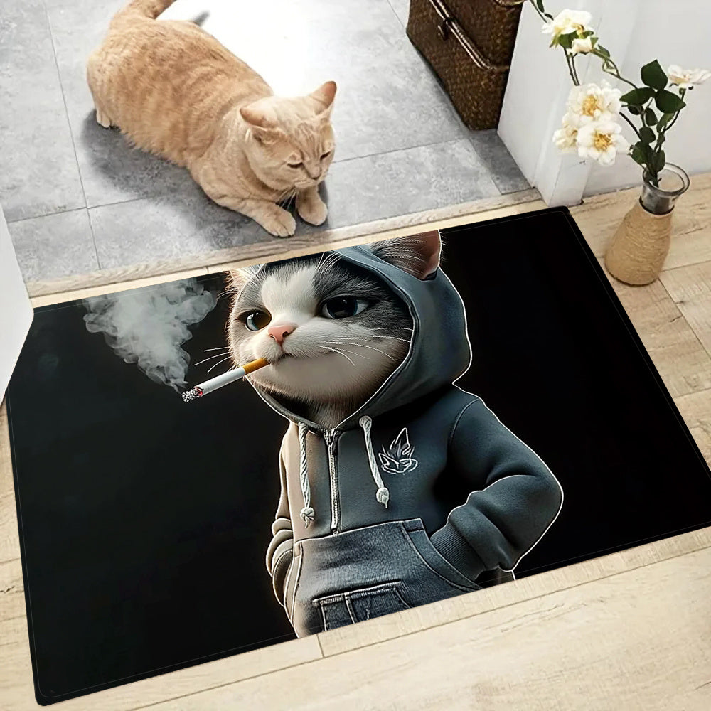 Small, machine washable doormat featuring a whimsical cat in a hoodie design. Made of durable polyester, this quick-dry mat is ideal for kitchen, bathroom, bedroom, and outdoor decor.