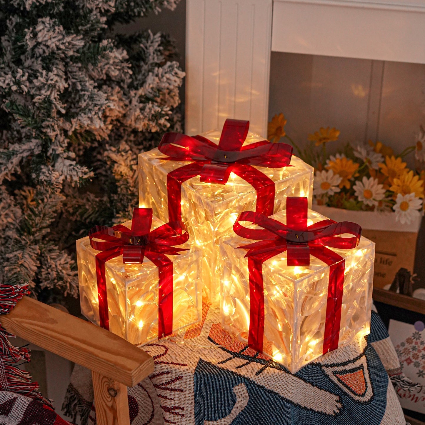 3 Christmas lighted gift boxes with warm white lights and red bows for decorating Christmas trees, yards, homes, and outdoor spaces.