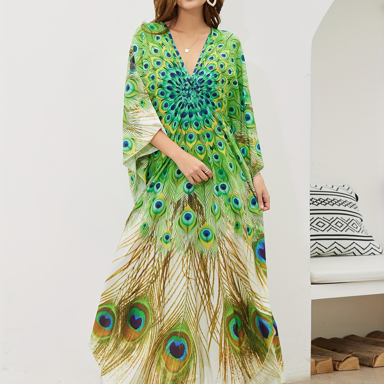 Handmade V-neck maxi beach dress in vibrant green, yellow, and blue peacock print, perfect cover-up for swimwear.