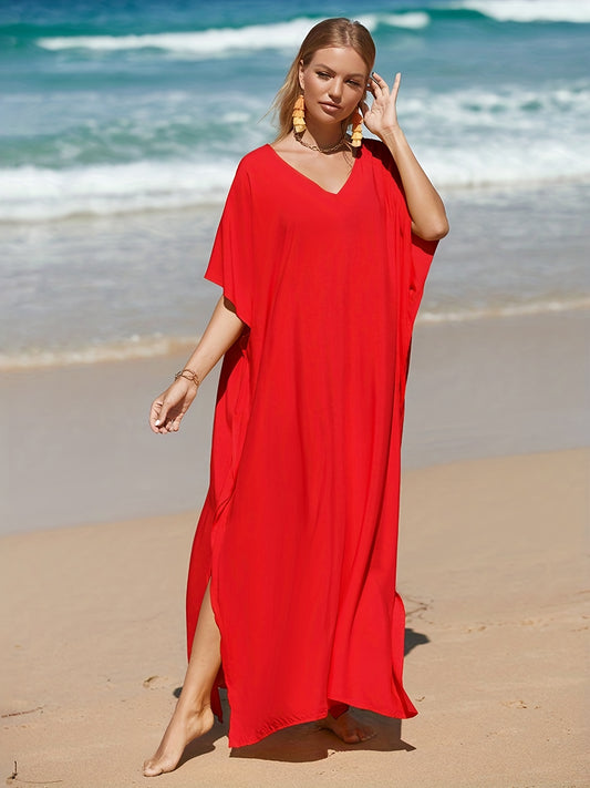 Stylish white beach kaftan dress with V-neck, loose fit, and batwing sleeves. Made of lightweight viscose, ideal as a bikini cover-up.