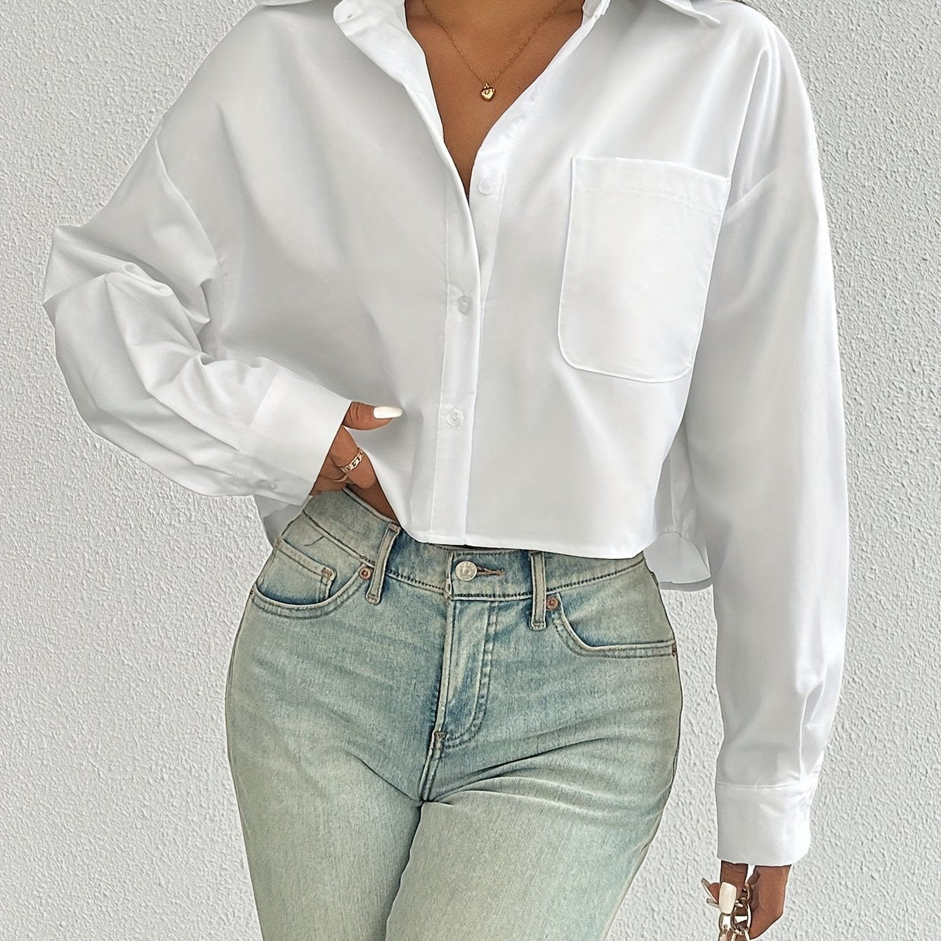 Stylish white casual shirt for women, drop shoulder, long sleeve, short style with pocket, button-up, made of 100% polyester, machine washable, ideal for casual wear.