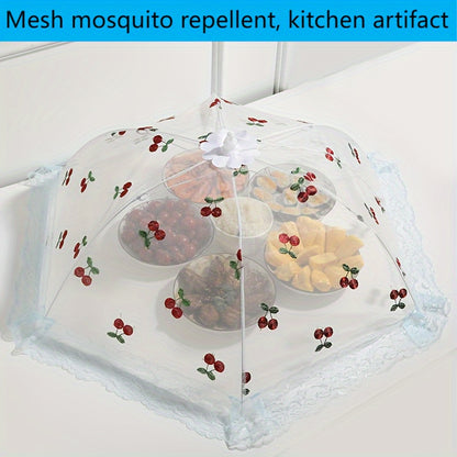 Foldable food cover with cherry design, lace trim and bow, protects against mosquitoes and dust, ideal for kitchen and dining.