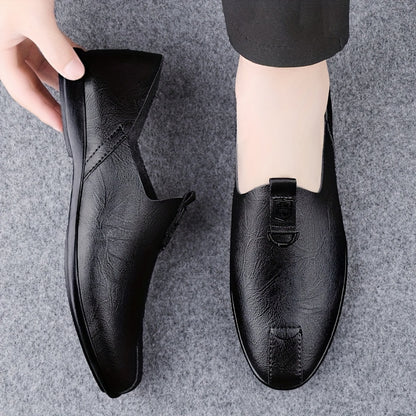 Sleek black slip-on shoes for men, breathable and fashionable with a durable sole.