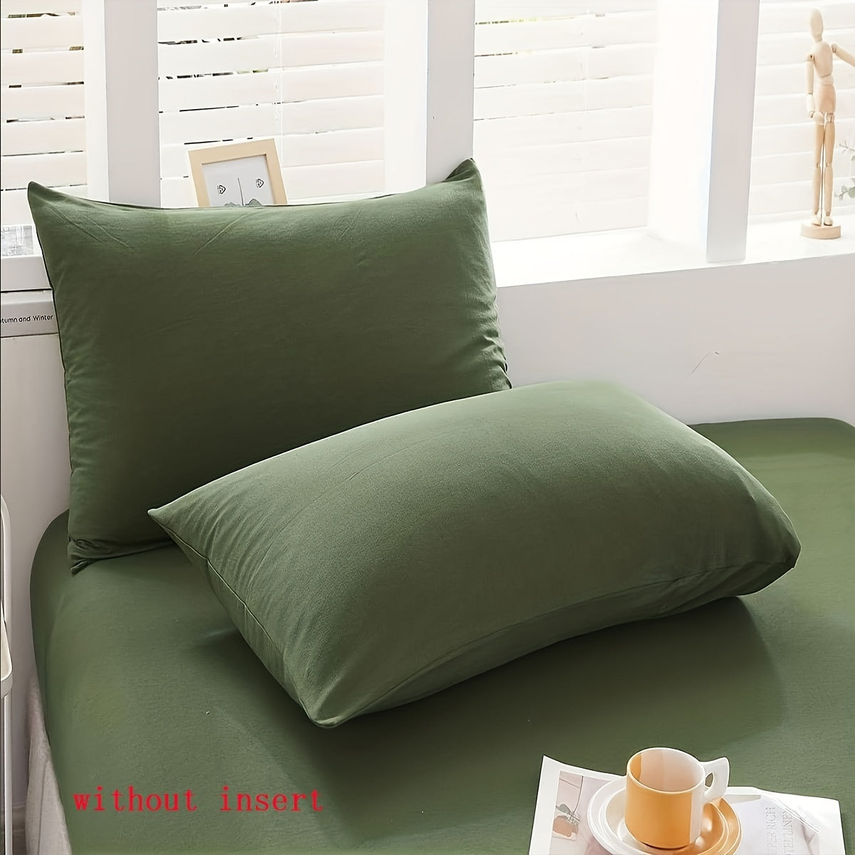 Two luxurious Army Green pillowcases made of soft brushed polyester, featuring a 100% weave. These pillowcases are machine washable and have a zipper closure for easy use. They are both elegant and durable, making them perfect bedroom accessories for