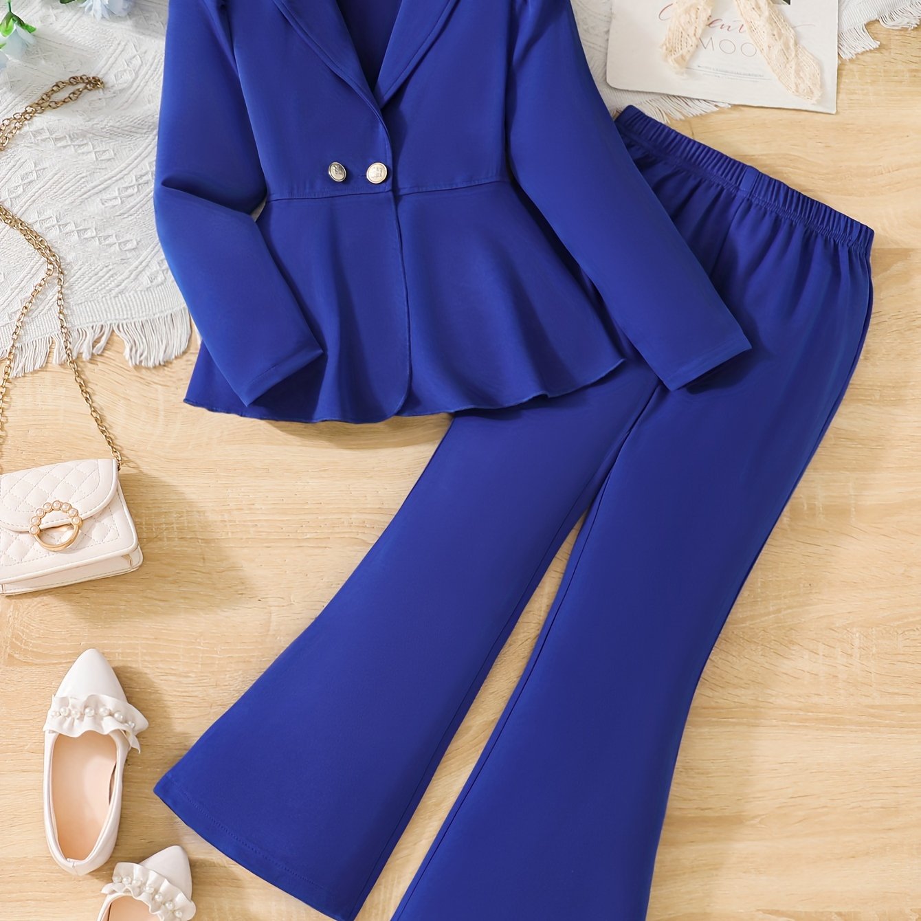 Stylish royal blue girls' suit with blazer and pants, ideal for outdoor wear in spring or fall. Machine washable with non-stretch fabric.