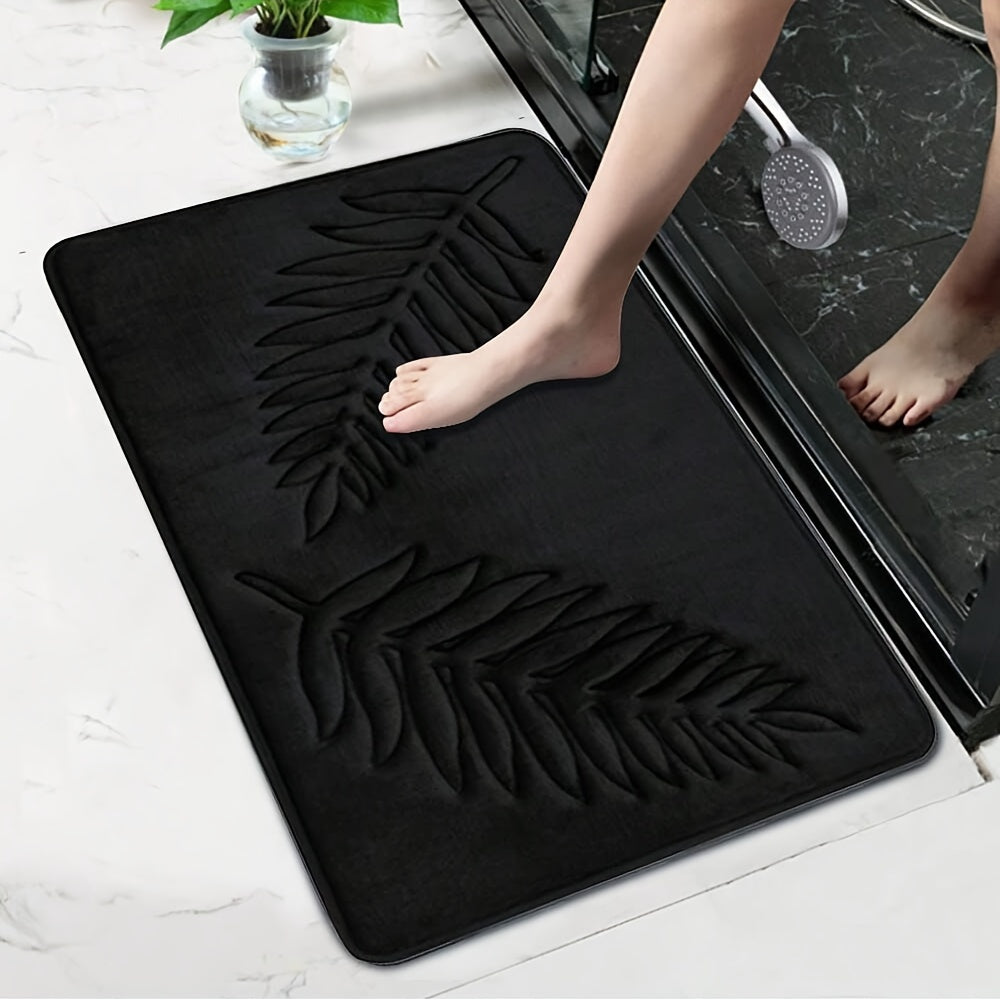 2-piece set of plush memory foam bathroom mats with a fern leaf design. These mats are non-slip, absorbent, and machine washable, making them perfect for adding a touch of style to your home decor.