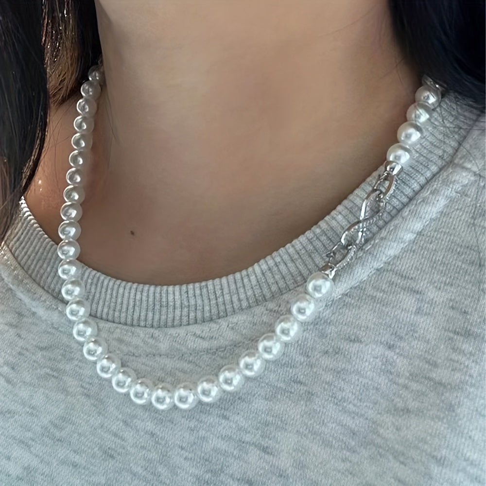 Indulge in Elegance with the JASTAR Double Strand Shell Pearl Necklace featuring 6mm and 8mm pearls, adorned with an Infinite Clasp and full zirconia inlay. Elevate your style with this luxurious fashion statement perfect for women, and with its