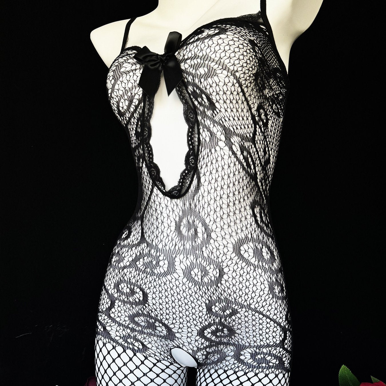 Sexy lace fishnet bodysuit for a romantic date or Valentine's Day. Black see-through stockings for confident nights.