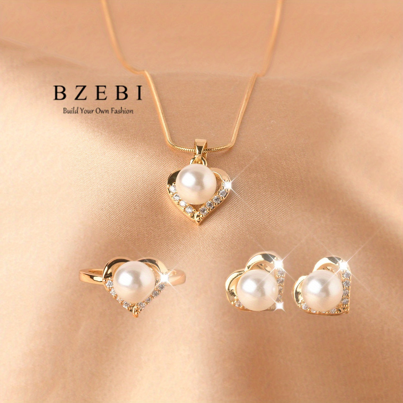 Set of four elegant jewelry pieces made of titanium and 18k gold plated, including earrings, necklace, and ring. Features a cute heart design with inlaid milky stone and shining zirconia stones.