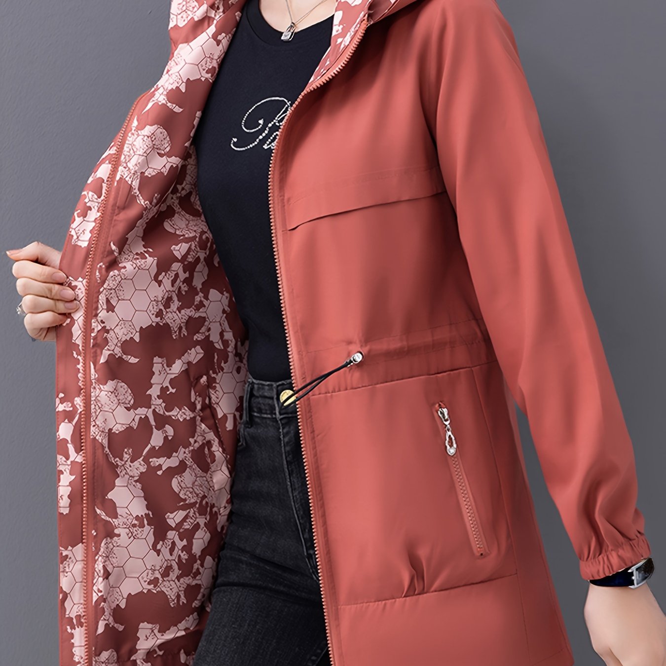 2025 Spring/Autumn reversible hoodie jacket for women with drawstring waist. Made of windproof and waterproof polyester, featuring a zip closure and drawstring hood.