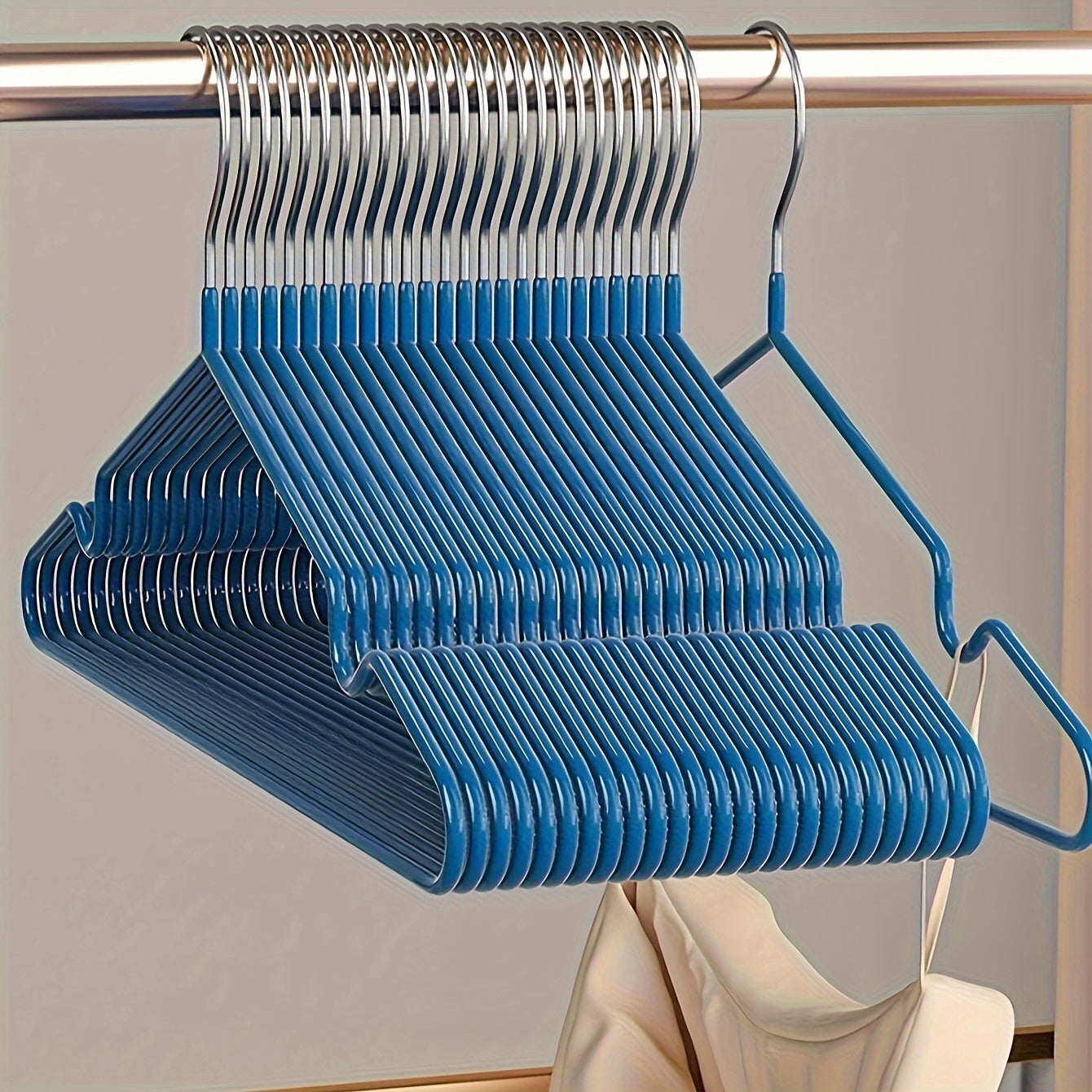 Essential for any home wardrobe, these durable non-slip metal hangers come in a convenient 10-pack. Featuring shoulder grooves to keep clothing in place, these space-saving hangers are perfect for hanging tops and dresses.