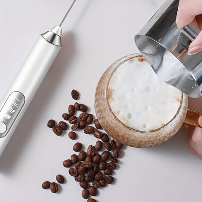 Portable USB rechargeable milk frother and coffee maker with automatic function, whisk attachment, and 1200mAh battery. Comes with measuring spoon and cup. Perfect for use at home or when traveling.