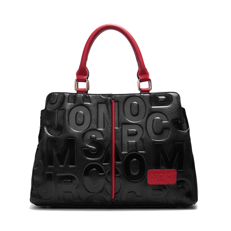 Luxury leather tote bag with embossed letters for women.