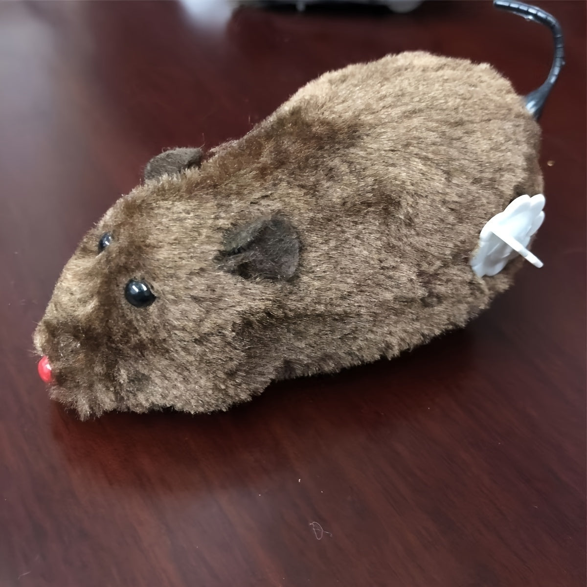 Non-electric, interactive cat toy with wind-up running rat made of durable vinyl material, suitable for kittens, promoting play and exercise without the need for batteries.